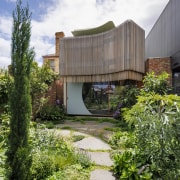 From the rear elevation, a floating veil of 