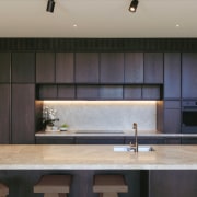 The strong yet pared back kitchen design. - 