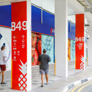 The wayfinding project incorporates stencilled symbols of pineapples, 