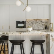 The crenulated island cabinetry in the breakfast bar 