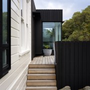 New interventions with the original house are clad 