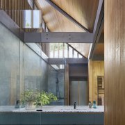 Main bathroom with giant mirror and stone benchtop 