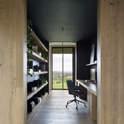 Home office with built-in shelving and desking. 