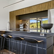 Wood cabinetry tones with the natural golf course 