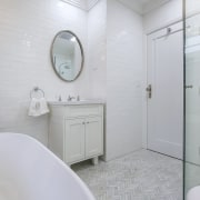 The master ensuite features traditional subway tile walls, 