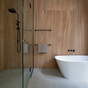 With a pared-back palette of large, timber-look tiles 