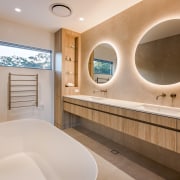 The use of natural stone and timber-look finishes 