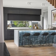 Diaphanous curtains soften the linear design. 