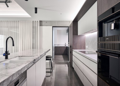 Recessed niches on the drawers bring a minimalist 