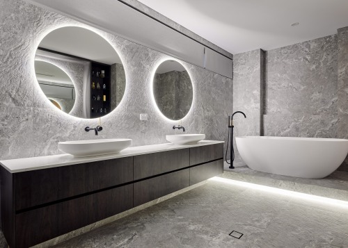 The long, pared back vanity has ablutionary space 