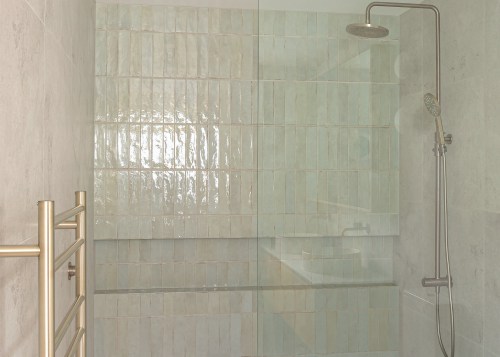 Pale green tiles and glass make for a 