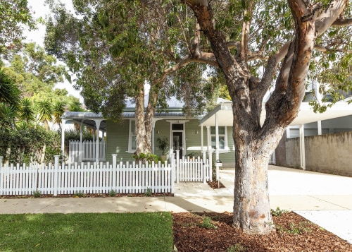 An existing high front fence was replaced with 