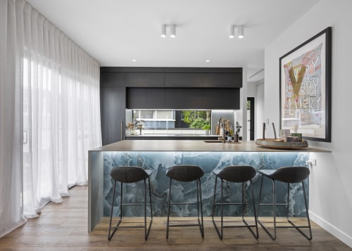 Onyx tiles, lit from under the benchtop, are 