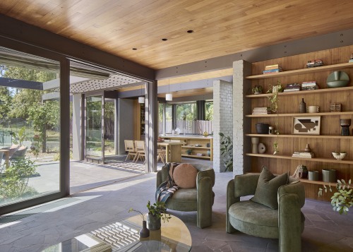 Natural wood finishes predominate even to the living 