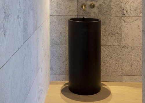 The freestanding basin has a sculptural presence – 