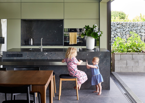 A lowered stainless-steel workspace cantilevers off the monolithic 
