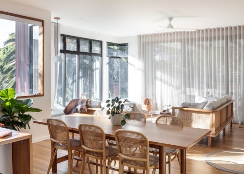 Kitchen to dining to living to rear deck 