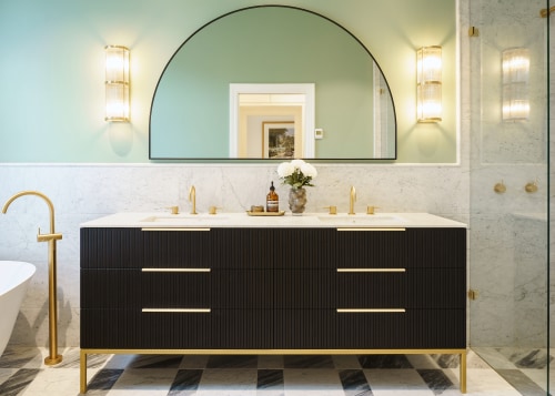 A double vanity and generous double shower form 