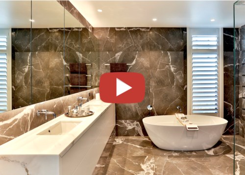 Dunlop Design Designer Suite video button - architecture architecture, bathroom, bathtub, building, ceiling, ceramic, design, floor, flooring, furniture, home, house, interior design, marble, material property, plumbing fixture, property, real estate, room, tap, tile, wall, orange, brown