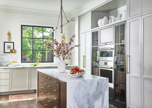 Panelled cabinetry adds to the traditional vibe. 