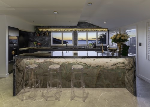 In this kitchen, transparent Ghost stools ensure nothing 