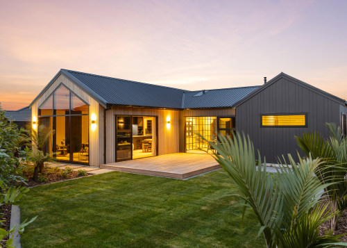 The rear of the home at dusk – 