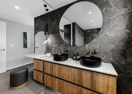 Two custom-made round mirrors are a standout feature, 