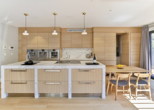 ​​​​​​​Natural-touch oak veneer on the perimeter cabinetry and architecture, cabinetry, countertop, cupboard, home, house, interior design, kitchen, lighting, tile, wood, wood flooring, oak, Matisse