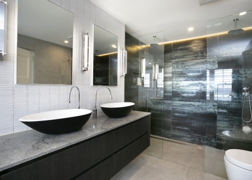 ​​​​​​​An open shower stall, backed in metallic, large-format architecture, bathroom, bathtub, building, ceiling, floor, flooring, furniture, home, house, interior design, material property, plumbing fixture, property, real estate, room, sink, tap, tile, gray, white