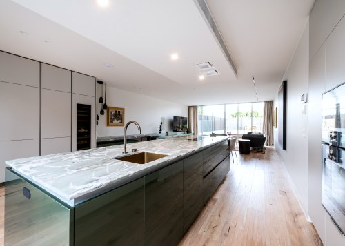 Poggenpohl cabinetry in Pine Green metallic gloss lacquer 
