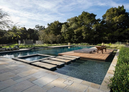 Pool and spa pool with pavers leading to 