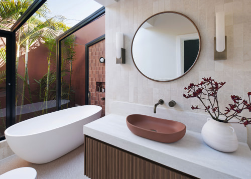 Mediterranean tones even extend to the organic-look vanity-top 