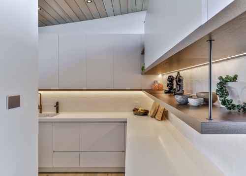 Walk-in scullery with under cabinet lighting. 