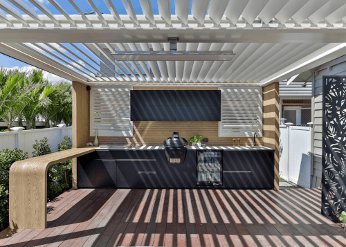 The outdoor kitchen boasts a dual operation louvre 