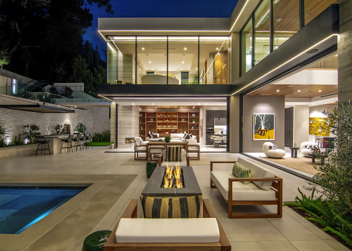The luxury resort-style home features giant sliding glass 