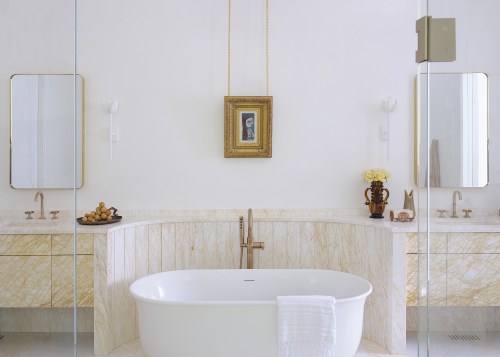 This bathroom's walls are finished in hand-applied plaster, 