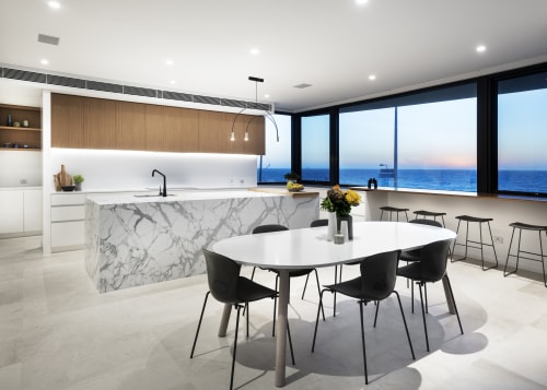 This kitchen offers both a focal point and architecture, building, cabinetry, ceiling, chair, countertop, design, dining room, floor, flooring, furniture, home, house, interior design, kitchen, living room, property, real estate, room, table, wall, white