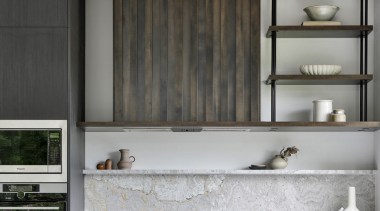 The powder-coated shelving and stone upstand situated above 