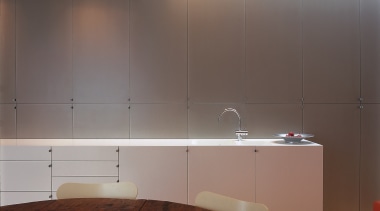 This is one end of the bench of cabinetry, ceiling, countertop, floor, flooring, hardwood, interior design, kitchen, lighting, room, tile, wall, wood, gray