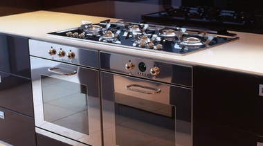Kitchen with stainless steel ovens and gas hob. countertop, gas stove, home appliance, kitchen, kitchen appliance, kitchen stove, major appliance, black