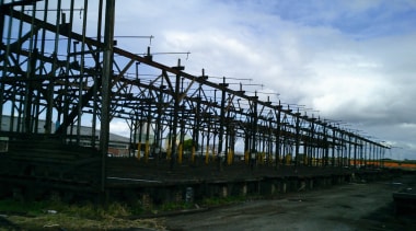 Old warehouse showing old wooden beam structure. - bridge, cloud, fixed link, girder bridge, sky, skyway, structure, black, teal
