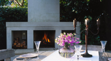 Inner view of the outdoor living area - backyard, courtyard, furniture, hearth, interior design, outdoor structure, patio, table, black