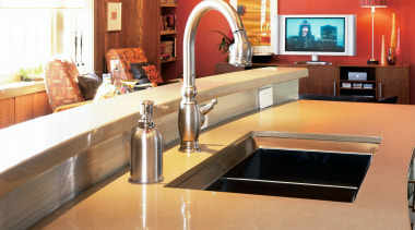 View of the kitchen area of this home countertop, floor, flooring, furniture, interior design, kitchen, room, table, orange