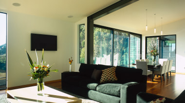 View of the living area, wooden flooring, large ceiling, house, interior design, living room, property, real estate, room, table, window, orange