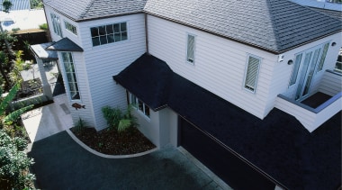 View of this large home - View of architecture, building, elevation, estate, facade, home, house, mansion, property, real estate, residential area, roof, siding, black