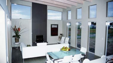 View of the main living area of this daylighting, house, interior design, real estate, window, gray, white