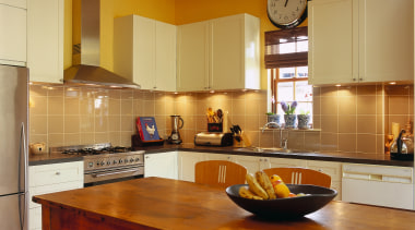 View of this kitchen area - View of cabinetry, ceiling, countertop, cuisine classique, floor, flooring, hardwood, interior design, kitchen, real estate, room, under cabinet lighting, wood flooring, brown, orange