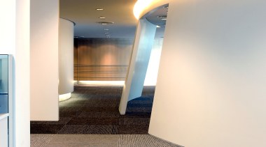 View of walkway through office boardered by sloping architecture, ceiling, daylighting, floor, flooring, interior design, property, real estate, white