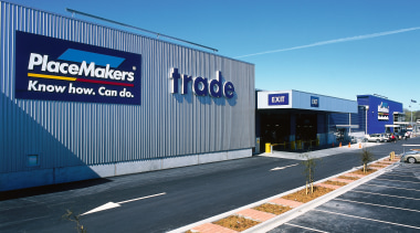 Exterior view of trade entrance to Placemakers store advertising, area, asphalt, building, corporate headquarters, infrastructure, metropolitan area, real estate, road, signage, sky, structure, blue