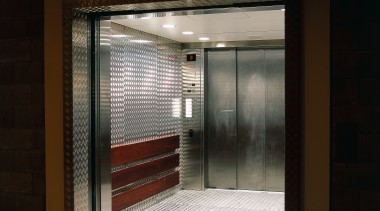 Service lift with heavy gauge aluminium chequer plate door, black